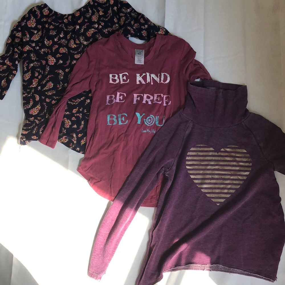 three children’s longsleeve shirts